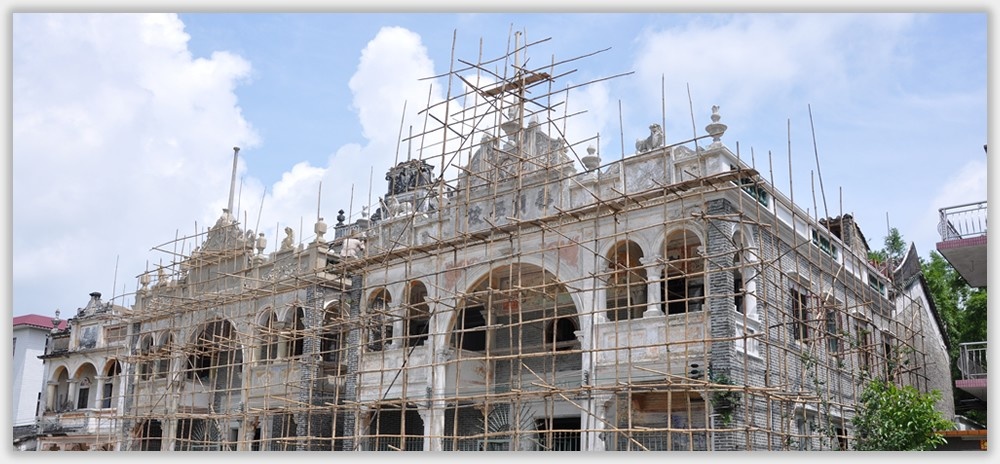 Ancestral hall facade in Cangdong Village under restoration with scaffolding