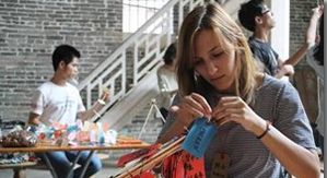 Students making crafts at an arts and crafts workshop in Cangdong Village